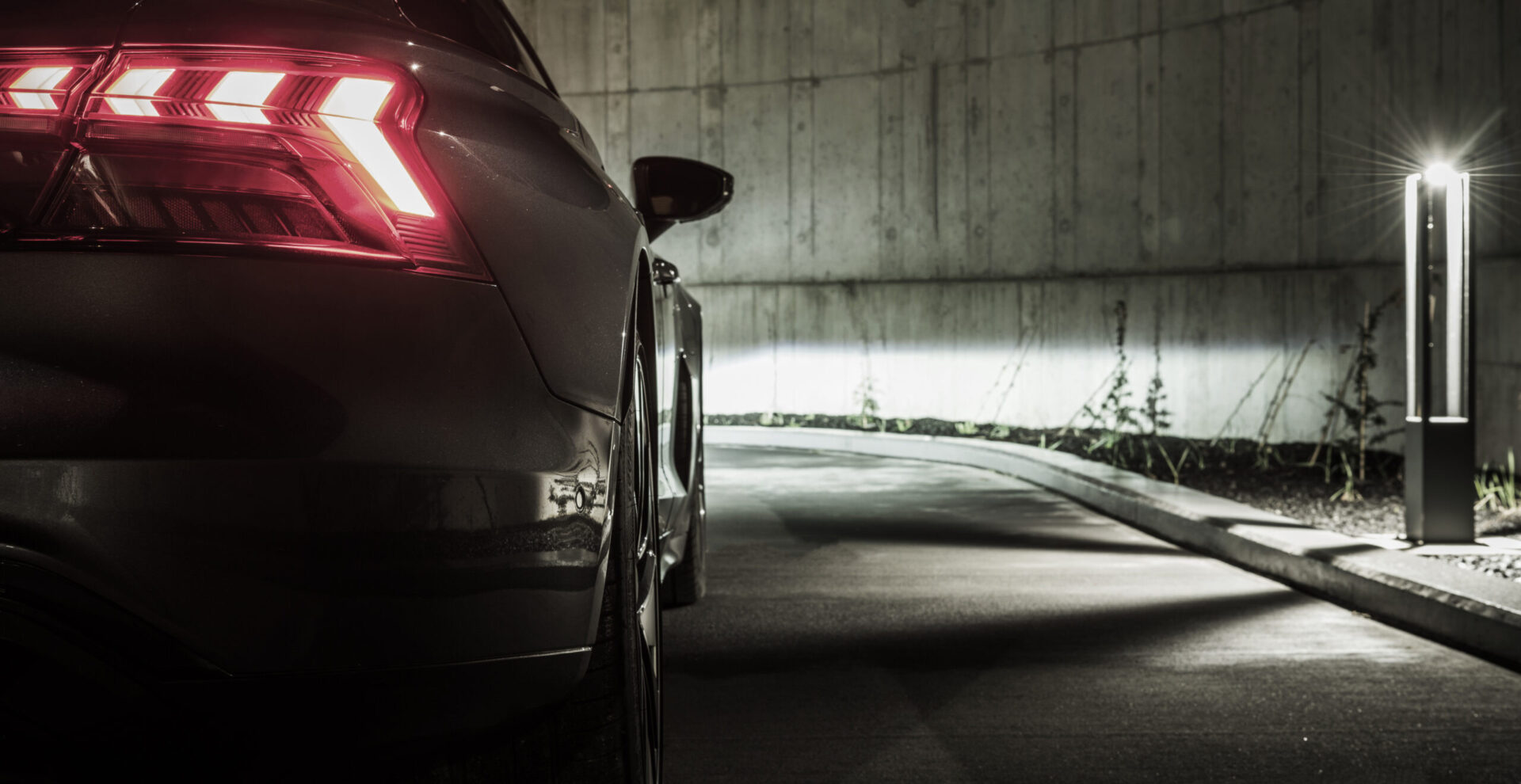 Modern Car on a Concrete LED Illuminated Driveway